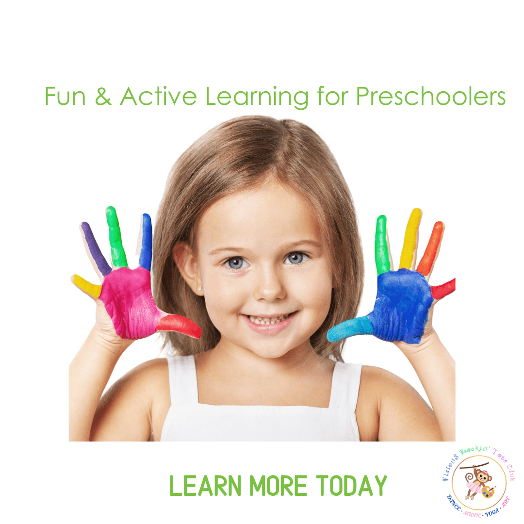 Smiling girl with colorful painted hands.